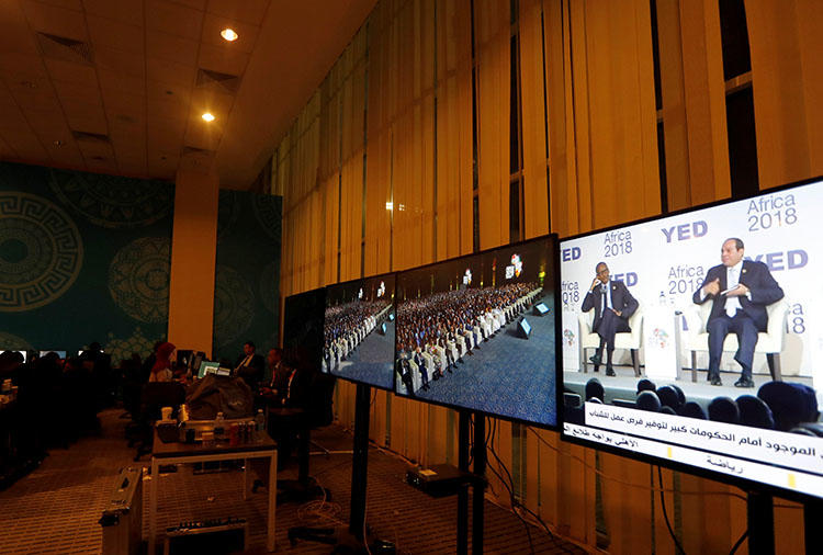 Egyptian President Abdel Fattah al-Sisi is seen on a television screen at the press center during the Africa 2018 Forum in Sharm el-Sheikh, Egypt, on December 8, 2018. An Egyptian TV presenter was sentenced to prison for an interview with a gay man on January 20, 2019. (Reuters/Amr Abdallah Dalsh)