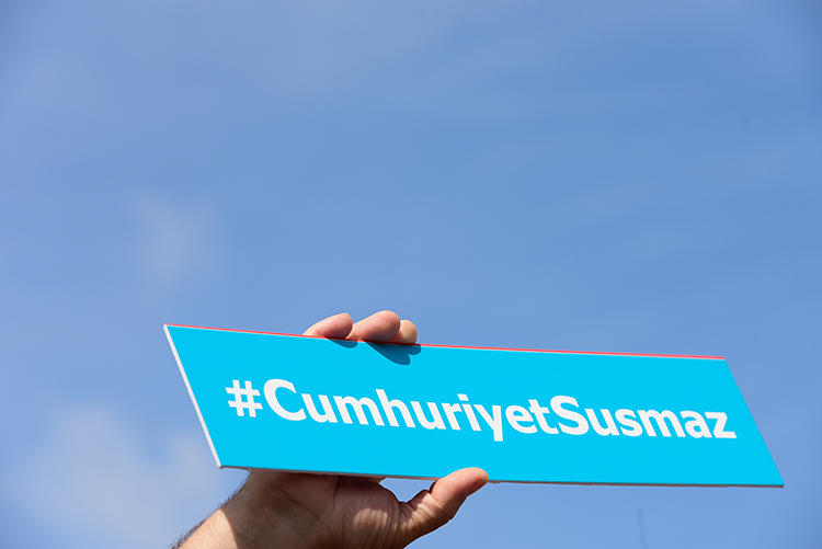 A sign reading 'Cumhuriyet will not be silent' is held during a protest outside Istanbul's court house in September 2017. An appeals court in February upheld the convictions of six staff at the paper. (AFP/Yasin Akgul)