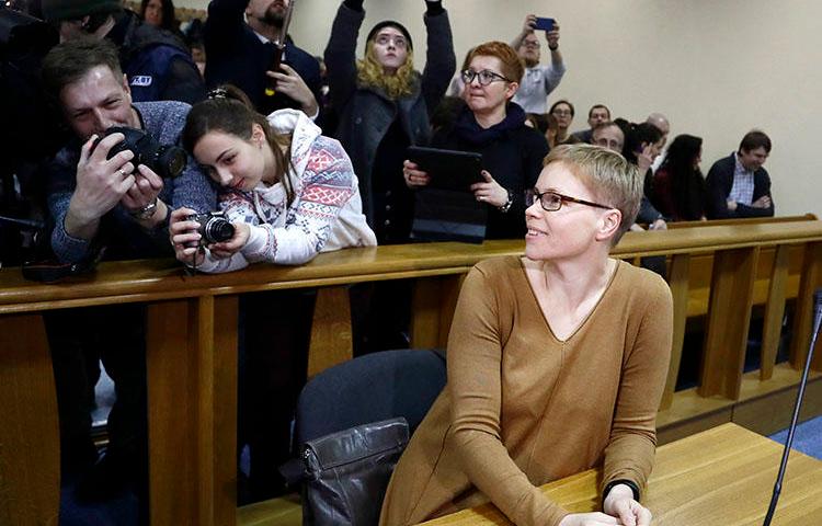 Marina Zolatava, editor-in-chief of the Belarusian independent news site Tut.by, sits in a Minsk court room prior to her preliminary hearing on two charges on February 12. (AP/Sergei Grits)