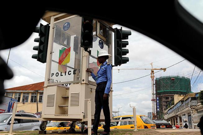 A traffic policewoman pictured in Yaoundé in October 2018. A journalist was attacked outside his home in the city on January 31. (Reuters/Zohra Bensemra)