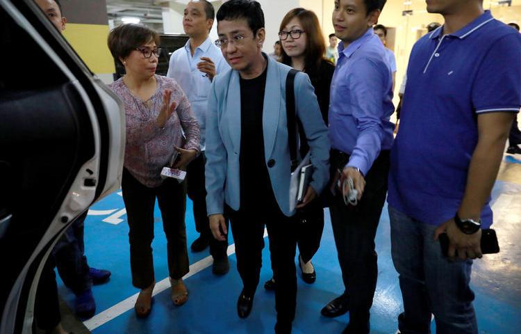 Maria Ressa leaves the Rappler office after being served an arrest warrant in Pasig City, Philippines, on February 13, 2019. (Reuters/Eloisa Lopez)