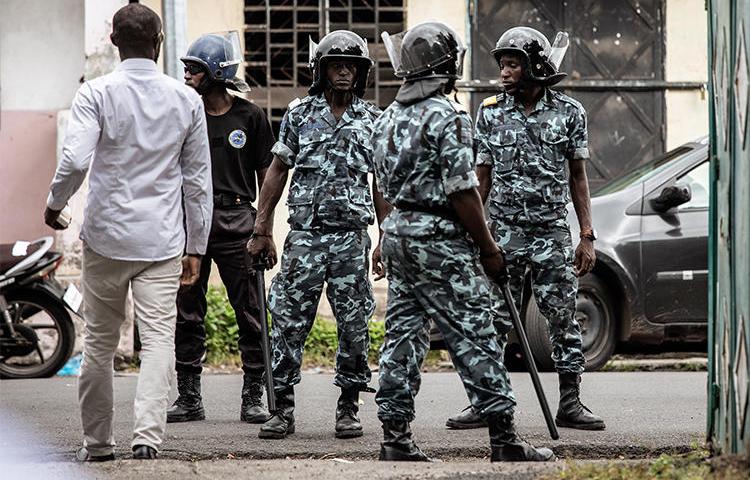 Gendarmerie officers stand guard on March 24, 2019, in Moroni, Comoros. Two journalists have been detained without trial in the country since February. (Gianluigi Guercia/AFP)