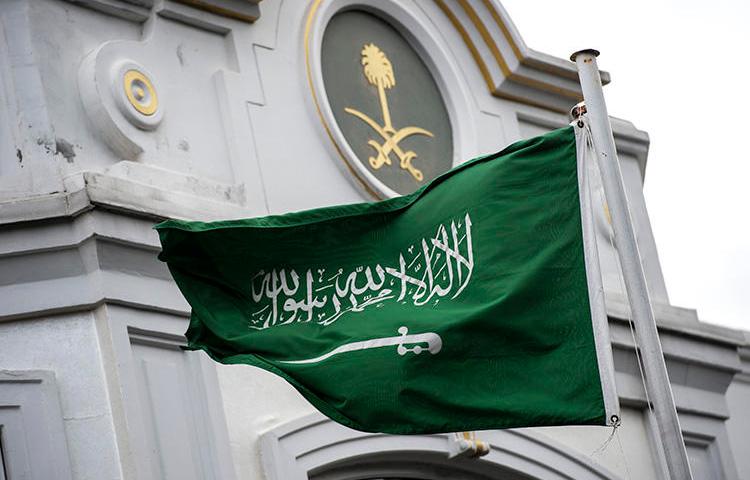 A Saudi flag flies in front of the country's consulate in Istanbul, where columnist Jamal Khashoggi was murdered, in October 2018. In Saudi Arabia, two female journalists who criticized the kingdom's driving ban are on trial. (AFP/Yasin Akgul)