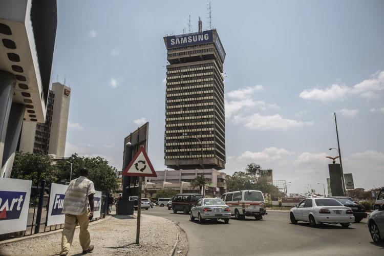 A man walks down a street in central Lusaka, the capital of Zambia, on November 12, 2014. Prime TV, an independent station in Zambia, was recently suspended by the country's media regulator. (Gianluigi Guercia/AFP)