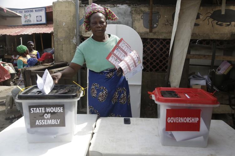 A woman casts her votes during the gubernatorial and state house assembly elections at a polling center in Lagos, Nigeria, on March 9, 2019. (Sunday Alamba/AP)