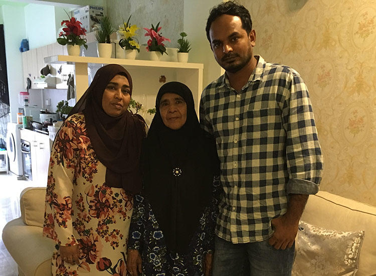 Ahmed Rilwan's mother, Aminath Easa, pictured center in her Malé home, with daughter Fathimath Shehenah and son Moosa. The family want answers to what happened five years ago. (CPJ)