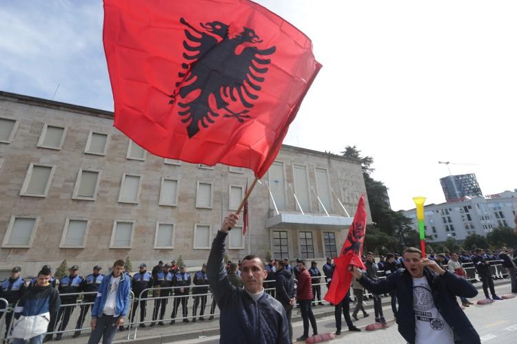 Protesters wave Albanian flags in Tirana, Albania, on March 16, 2019. A British journalist living in Albania has recently been attacked in a smear campaign after she gave comments on the RT network. (Florion Goga/Reuters)