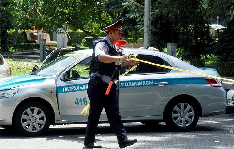 A police officer in Almaty, Kazakhstan, on July 18, 2016. Journalist Saniya Toiken was recently arrested and fined after covering protests in the Kazakh city of Zhanaozen. (Shamil Zhumatov/Reuters)