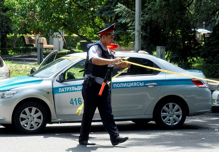 A police officer in Almaty, Kazakhstan, on July 18, 2016. Journalist Saniya Toiken was recently arrested and fined after covering protests in the Kazakh city of Zhanaozen. (Shamil Zhumatov/Reuters)