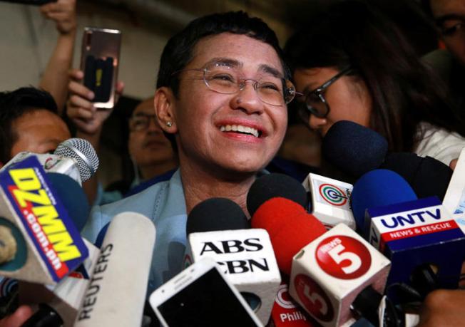 Maria Ressa, executive editor of news website Rappler, speaks to the media after posting bail in a cyber-libel case at a court in Manila City, Philippines, on February 14, 2019. Philippine authorities issued arrest warrants for Ressa and several other Rappler executives on March 28 in a separate case. (Reuters/Eloisa Lopez)