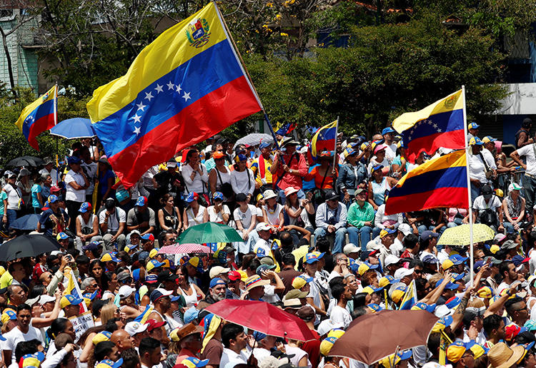 Supporters of the Venezuelan opposition leader Juan Guaido take part in a rally against Nicolas Maduro's government in Caracas, Venezuela, on March 4, 2019. Venezuelan counterintelligence agents detained a U.S. freelancer and his Venezuelan fixer on March 6. (Reuters/Carlos Garcia Rawlins)