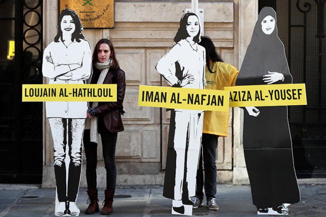 Demonstrators urge Saudi authorities to release jailed women's rights blogger Eman Al Nafjan and activists Loujain al-Hathloul and Aziza al-Yousef outside the Saudi Arabian embassy in Paris on March 8, 2019. Today, Al Nafjan and two activists were released from prison. (Benoit Tessier/Reuters)