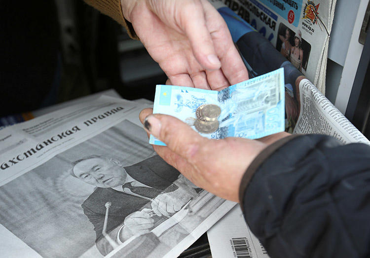 The front page of a March 20 newspaper shows President Nursultan Nazarbayev, who resigned the previous day. Kazakhstan's press was restricted and censored under his long rule. (Reuters/Pavel Mikheyev)