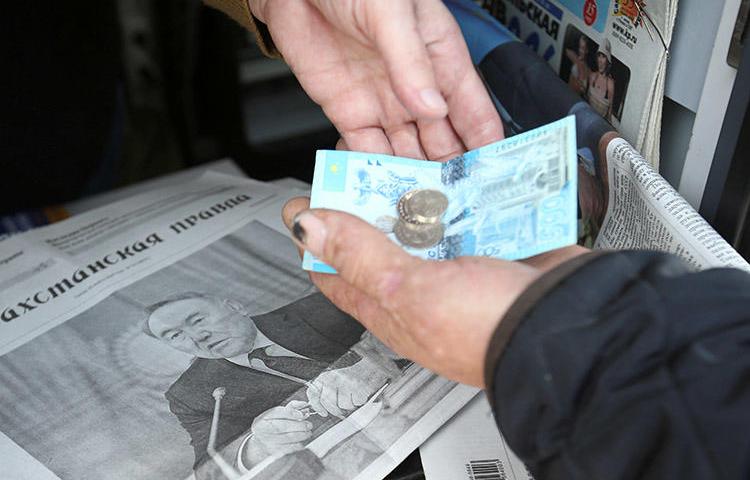 The front page of a March 20 newspaper shows President Nursultan Nazarbayev, who resigned the previous day. Kazakhstan's press was restricted and censored under his long rule. (Reuters/Pavel Mikheyev)