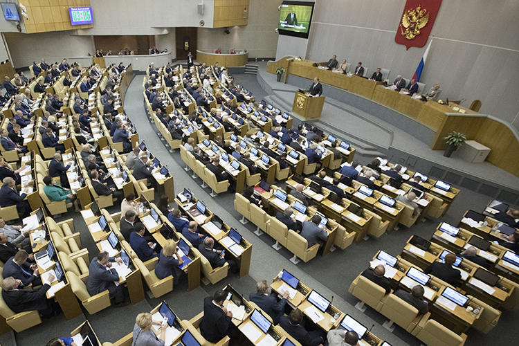 Russian lawmakers are seen in the State Duma on May 22, 2018. The Duma recently considered amendments that would restrict foreign print media in the country. (AP/Pavel Golovkin)