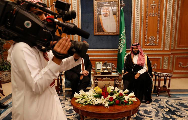 A cameraman gets into position as U.S. Secretary of State Mike Pompeo meets with Saudi Crown Prince Mohammed bin Salman in Riyadh, Saudi Arabia, on October 16, 2018. At least four journalists were recently arrested in Saudi Arabia, and their whereabouts are unknown. (AP/Leah Millis)