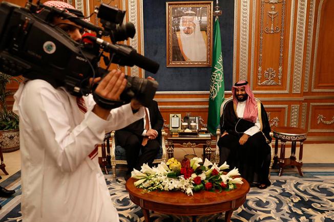 A cameraman gets into position as U.S. Secretary of State Mike Pompeo meets with Saudi Crown Prince Mohammed bin Salman in Riyadh, Saudi Arabia, on October 16, 2018. At least four journalists were recently arrested in Saudi Arabia, and their whereabouts are unknown. (AP/Leah Millis)