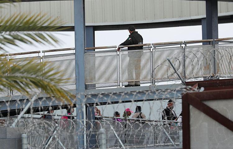 A Mexican official pictured at the bridge connecting Tijuana and San Diego, in April 2018. The Department of Homeland Security is investigating the policies of Customs and Border Protection after documents appeared to show that the agency targeted journalists. (Reuters/Mike Blake)