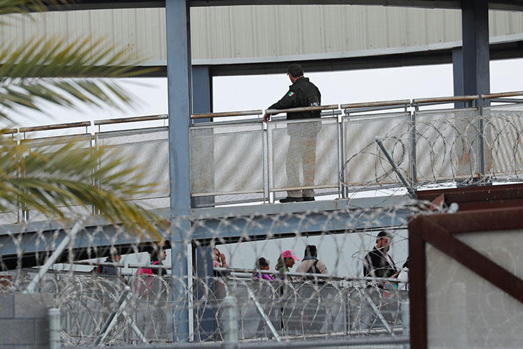 A Mexican official pictured at the bridge connecting Tijuana and San Diego, in April 2018. The Department of Homeland Security is investigating the policies of Customs and Border Protection after documents appeared to show that the agency targeted journalists. (Reuters/Mike Blake)