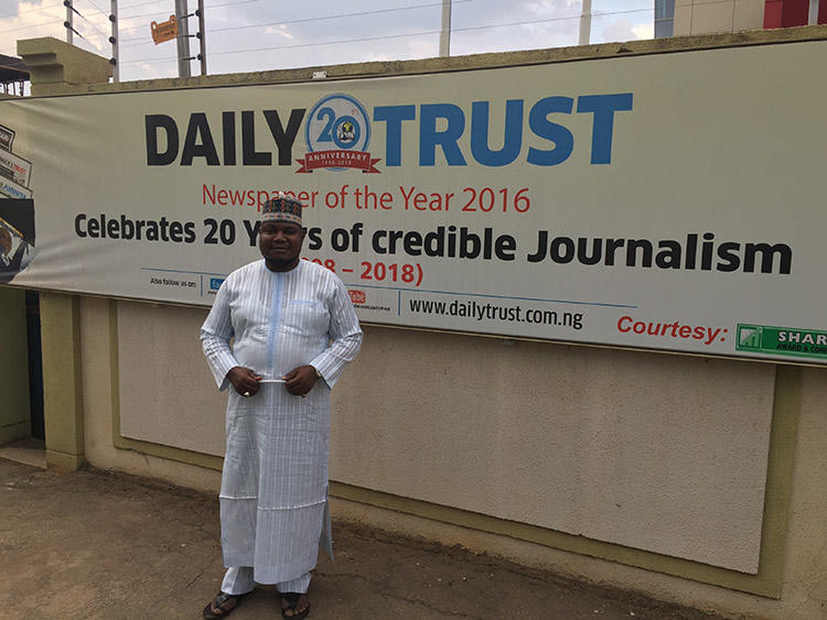 Nurudeen Abdallah, investigations editor of the Daily Trust, pictured outside the newspaper's headquarters in Abuja. The paper was raided by the military in January. (CPJ/Jonathan Rozen)
