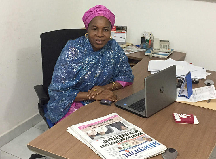 Zainab Suleiman Okino sits at her desk in the Blueprint office in Abuja. (CPJ/Jonathan Rozen)