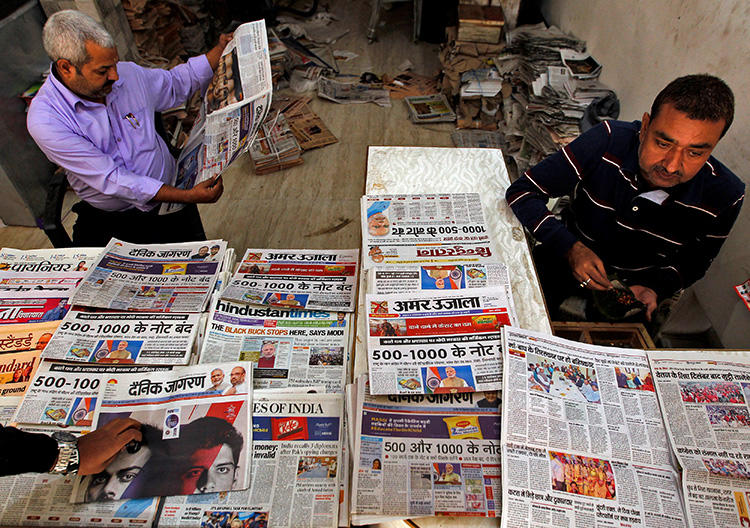 A man reads a newspaper in Allahabad, India, on November 9, 2016. A Bengaluru court recently passed a gag order barring the Indian press and international social media networks from publishing derogatory remarks about a local political candidate. (Reuters/Jitendra Prakash)