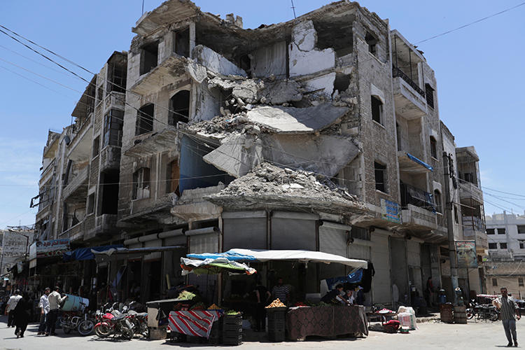 A damaged building is seen in Idlib, Syria, on May 25, 2019. (Reuters/Khalil Ashawi)