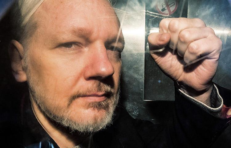WikiLeaks founder Julian Assange, pictured in a prison van in the U.K. on May 1, 2019. The U.S. has disclosed charges under the Espionage Act against Assange. (AFP/Daniel Leal-Olivas)