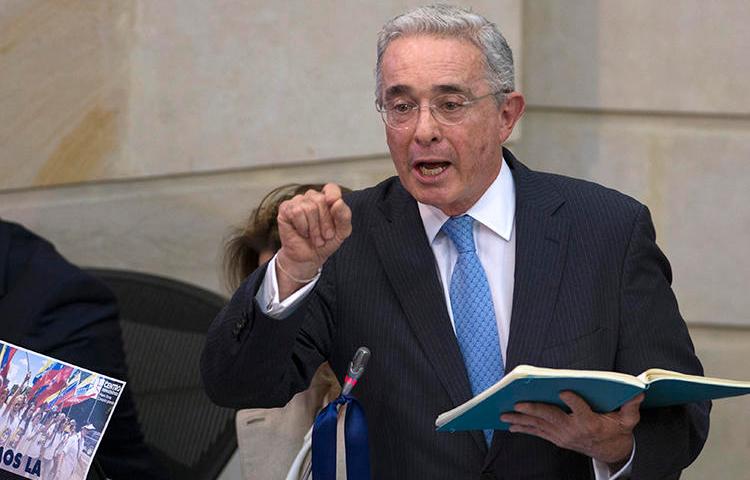 Senator Alvaro Uribe Velez is seen at the National Congress in Bogota, Colombia, on April 30, 2019. Uribe and his allies have recently filed defamation suits and retraction requests against journalist Daniel Coronell. (AFP/Diana Sanchez)