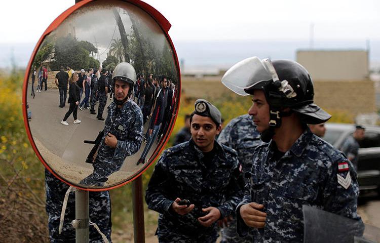 Security forces are seen in east Beirut, Lebanon, on May 9, 2019. Security forces recently raided the Beirut office of Al-Akhbar newspaper. (AP/Hassan Ammar)