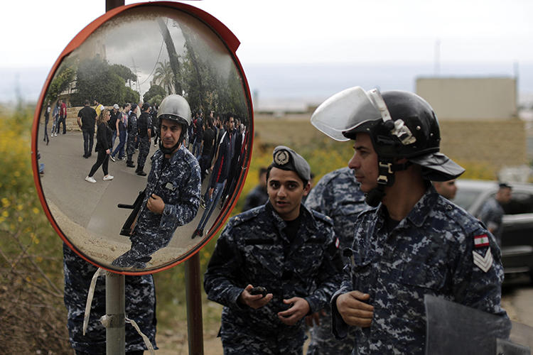 Security forces are seen in east Beirut, Lebanon, on May 9, 2019. Security forces recently raided the Beirut office of Al-Akhbar newspaper. (AP/Hassan Ammar)