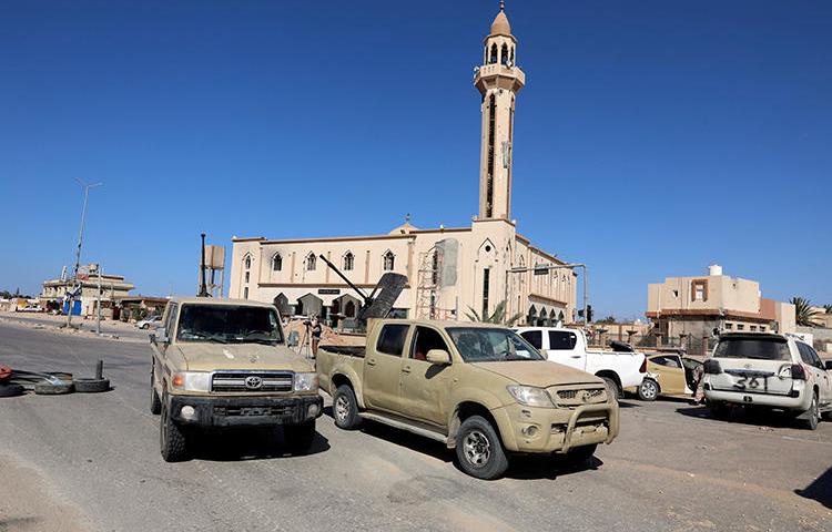 Military vehicles are seen in Salah al-Din, south of Tripoli, Libya, on May 7, 2019. Two Libyan journalists were recently abducted in Tripoli by forces affiliated with the Libyan National Army. (Reuters/Hani Amara)