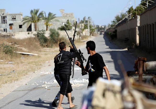 A photo of fighters taken by Reuters photographer Hani Amara, south of Tripoli, on May 7. Amara was injured while covering clashes in Libya on May 12. (Reuters/Hani Amara)