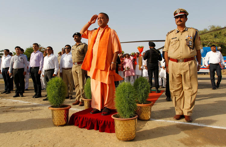 Yogi Adityanath, chief minister of India's most populous state, Uttar Pradesh, salutes as he inspects an honor guard during a visit to Allahabad, India, June 3, 2017. REUTERS/Jitendra Prakash