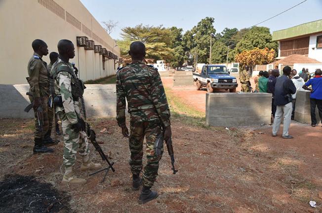 Central African Republic gendarmes and police officers are seen on January 2, 2016, in Bangui. Police in Bangui allegedly assaulted two French reporters from AFP recently. (AFP/Issouf Sanogo)