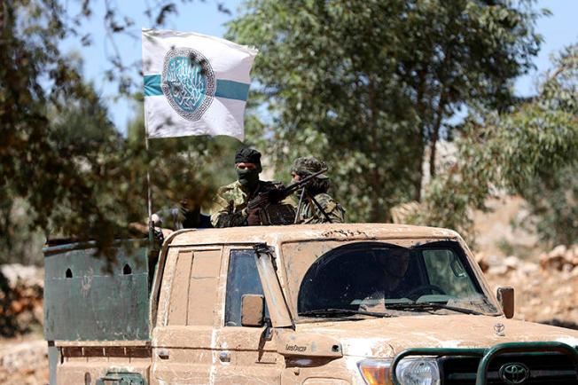 Hayat Tahrir al-Sham members are seen in northern Idlib on August 14, 2018. Militants from the group recently detained journalist Maan Bakour. (AFP/Omar Haj Kadour)