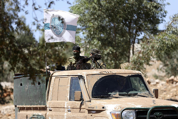 Hayat Tahrir al-Sham members are seen in northern Idlib on August 14, 2018. Militants from the group recently detained journalist Maan Bakour. (AFP/Omar Haj Kadour)