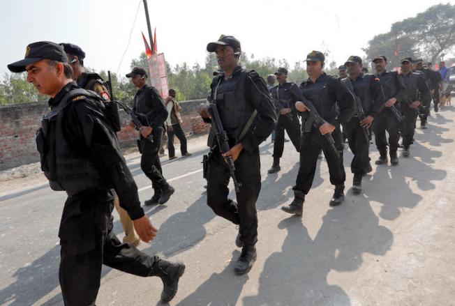 Police officers are seen in Uttar Pradesh, India, on November 25, 2018. Uttar Pradesh police recently arrested two TV journalists in a defamation case in the state. (Reuters/Pawan Kumar)