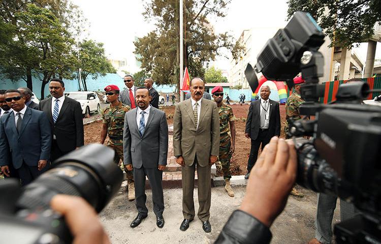 Eritrean President Isaias Afwerki, right, stands with and Ethiopian Prime Minister Abiy Ahmed in Addis Ababa, Ethiopia, on July 16, 2018. CPJ has called for the UN to continue to scrutinize Eritrea's human rights situation. (Reuters/Tiksa Negeri)