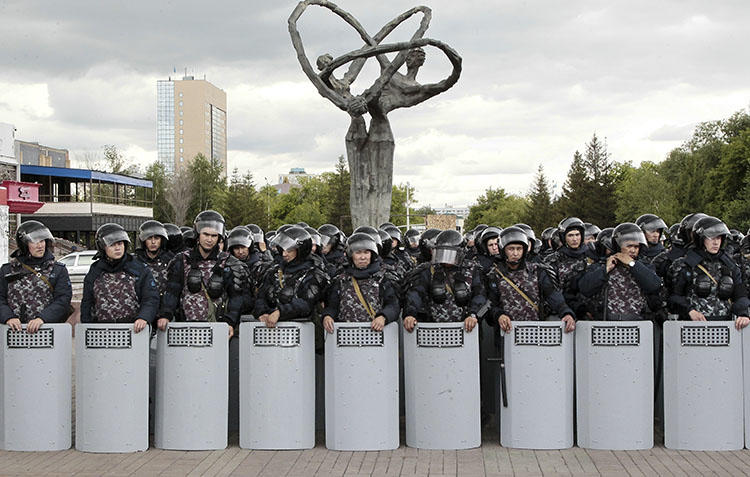 Kazakh police block an area to prevent protests against presidential elections in Nur-Sultan, the capital city of Kazakhstan, on June 10, 2019. Local internet users are being asked to download a security certificate that could allow the authorities to monitor or censor encrypted websites. (AP Photo/Alexei Filippov)