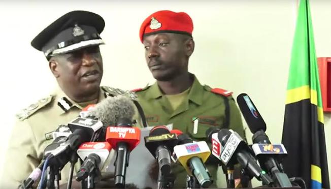 A screenshot of Dar es Salaam police chief Lazaro Mambosasa, left, speaking at a July 30 press conference. Mambosasa said that police have detained freelancer Erick Kabendera. (YouTube/Kwanza TV)