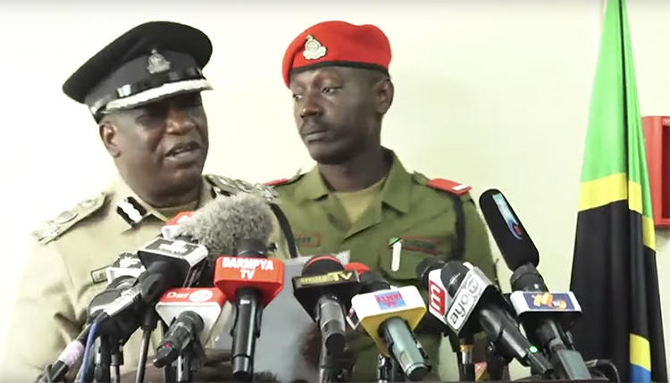 A screenshot of Dar es Salaam police chief Lazaro Mambosasa, left, speaking at a July 30 press conference. Mambosasa said that police have detained freelancer Erick Kabendera. (YouTube/Kwanza TV)