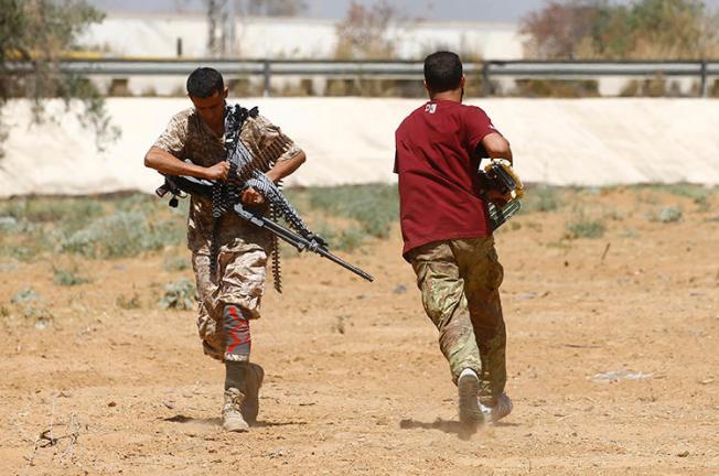 Fighters loyal to the internationally recognized Libyan Government of National Accord are seen in Tripoli on June 19, 2019. Freelance journalist Hamza Turkia was shot and injured in Tripoli that day. (AFP/Mahmud Turkia)