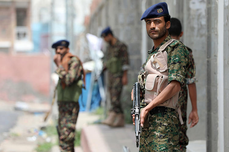 Yemeni police officers are seen in Taez on July 2, 2018. Yemeni security forces recently arrested freelance journalist Yahya al-Sawari. (AFP/Ahmad al-Basha)