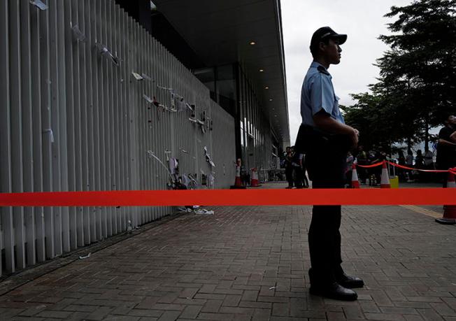 A police officer is seen in Hong Kong on July 2, 2019. On July 1, unidentified assailants vandalized pro-democracy broadcaster Citizens' Radio. (AP/Vincent Yu)