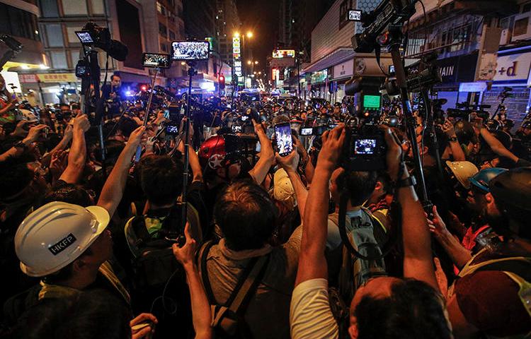 Journalists are seen in Hong Kong on July 7, 2019. The Hong Kong Journalists Association recently released a report showing a deterioration of press freedom in the special administrative region. (AP/Andy Wong)