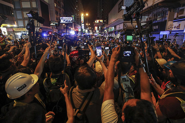 Journalists are seen in Hong Kong on July 7, 2019. The Hong Kong Journalists Association recently released a report showing a deterioration of press freedom in the special administrative region. (AP/Andy Wong)