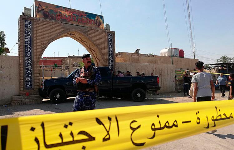 Security forces are seen in Baghdad, Iraq, on June 21, 2019. The Baghdad offices of Al-Journal and 7C TV were recently raided in Baghdad following a corruption investigation. (AP/Hadi Mizban)