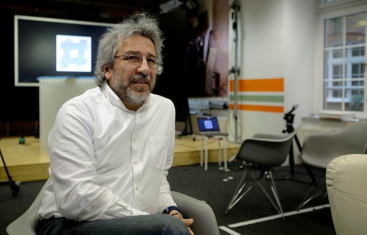Can Dündar, the former editor-in-chief of Cumhuriyet newspaper pictured on April 7, 2017, now runs nonprofit online radio station 'Ozguruz' from exile in Germany. (AP/Markus Schreiber)