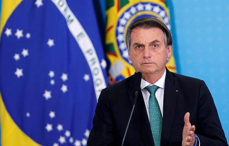 Brazilian President Jair Bolsonaro is seen in Brasilia on July 24, 2019. He recently threatened that journalist Glenn Greenwald may face jail time in Brazil. (Reuters/Adriano Machado)